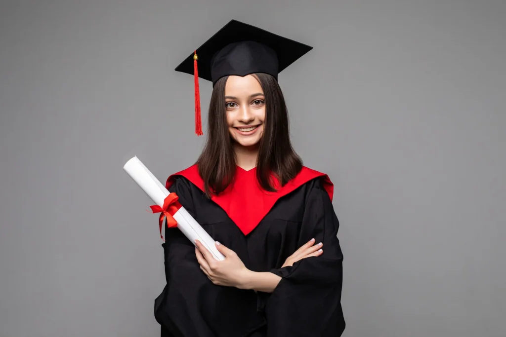 happy-student-with-graduation-hat-diploma-grey-scaled